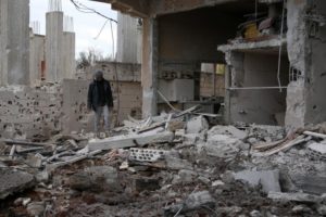 A man inspects a damaged house after an airstrike on al-Yadouda village, in Deraa Governorate, Syria February 15, 2017. REUTERS/Alaa Al-Faqir